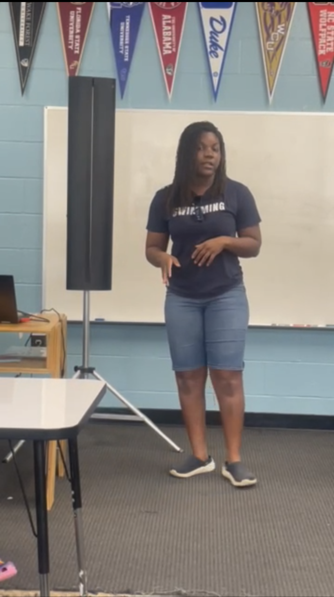 Coach Z talking about water safety to a group of young ladies at the Boys and Girls club in SE Raleigh