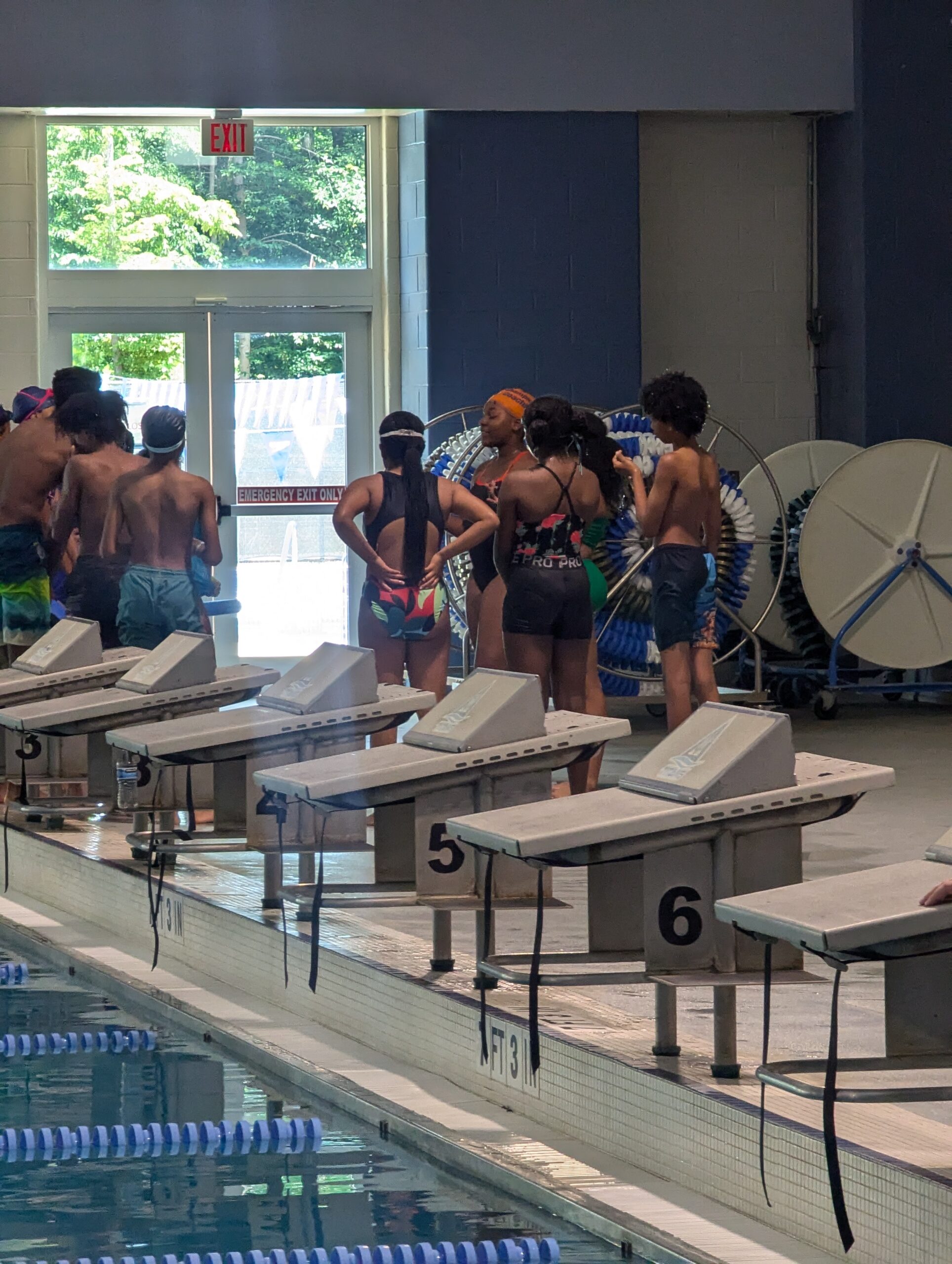 Coach Zion teaching students how to swim